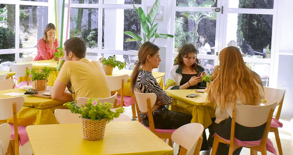 Marbella design academy facilities gaudi cafeteria indoors vista students chatting - Marbella Design Academy