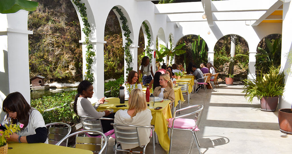 Marbella design academy facilities gaudi cafeteria vista students chatting lake - Marbella Design Academy
